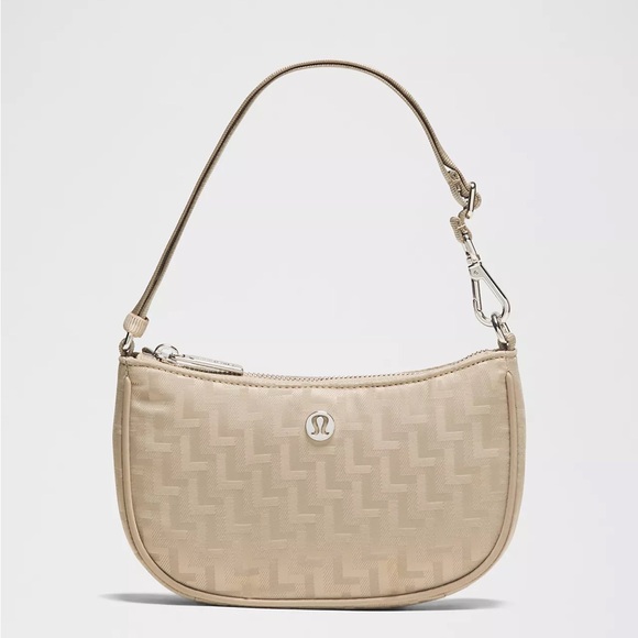 lululemon athletica Handbags - lululemon mini 1L bag L Monogram Jacquard Oak Color New
